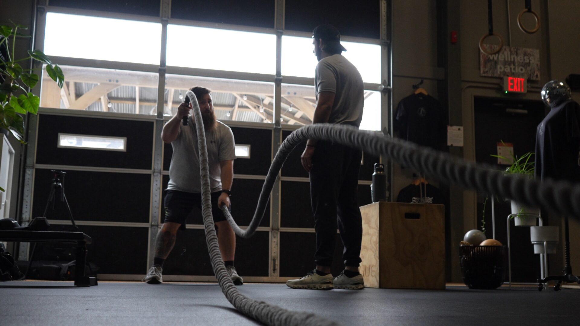 Dynamic Athletics coaches training with battle ropes